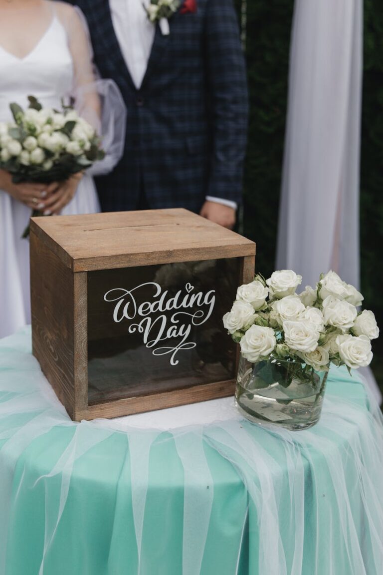 a box beside a bouquet of white flowers
