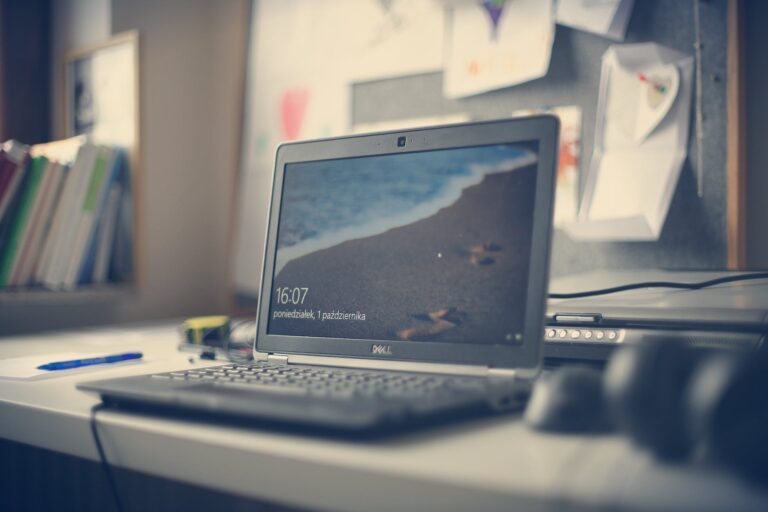black dell laptop on white desk