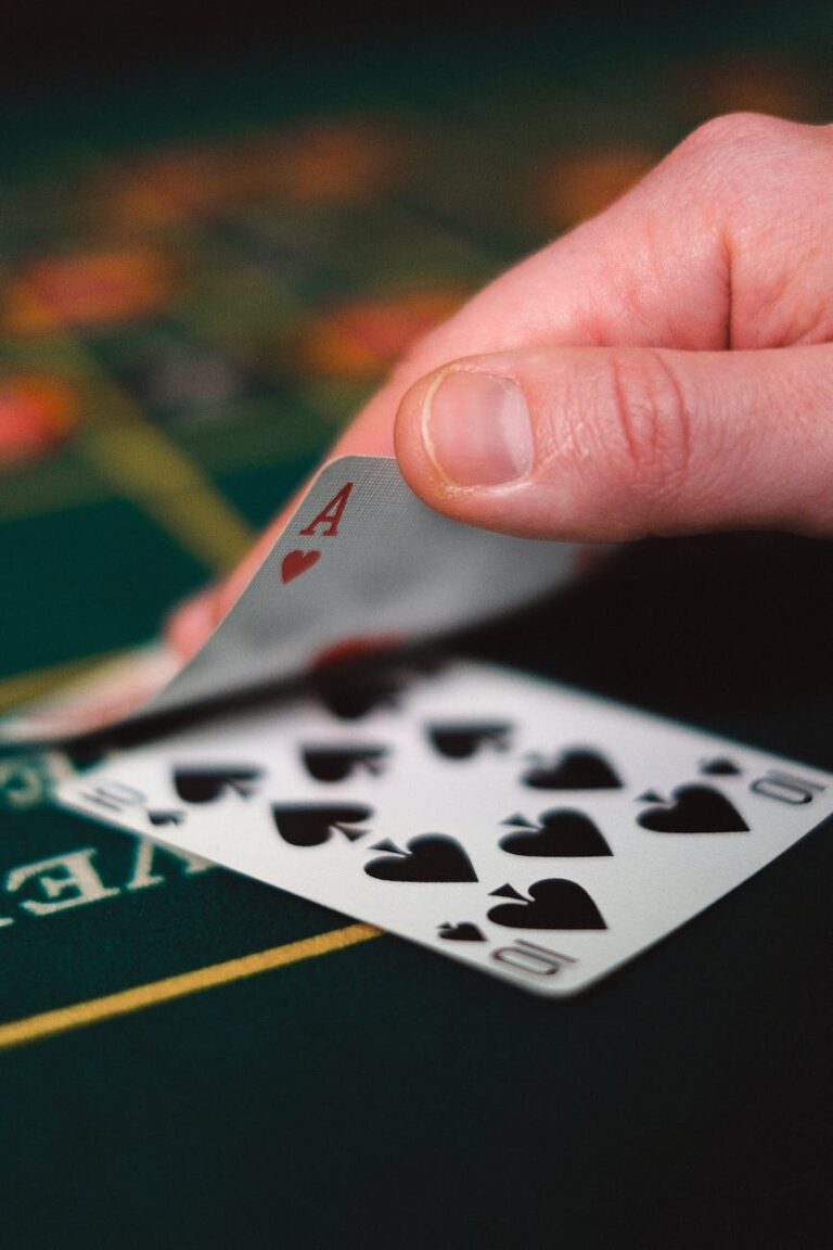 a person holding gaming cards